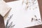 Blank Paper On Table With Book And Dried Flowers