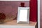 Blank photo frame on the chest of drawers