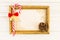Blank picture frame with Christmas cane candy on wood
