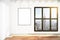 Blank picture frame on white wall in loft empty room with city v