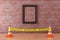 Blank Picture Frame with Yellow Tape Do Not Cross Police Line with Road Cones in Museum. 3d Rendering
