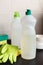 Blank plastic bottle with liquid dishwashing detergent on kitchen table