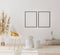 Blank poster frames mockup in modern interior background with empty white wall, chair and pampas grass, luxury living room