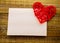 Blank present Valentine card on wooden background