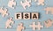 Blank puzzles and wooden cubes with the FSA Flexible Spending Account lie on a light blue background