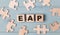 Blank puzzles and wooden cubes with the text EAP Employee Assistance Program