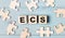 Blank puzzles and wooden cubes with the text ECS Electronic Clearing Service lie on a light blue background