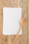 Blank recipe paper with wooden spoon