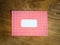 Blank red an white checked windowed envelope