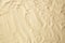 Blank sand texture for your design. Empty sandy beach background. Flat lay. Top view