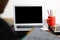 Blank screen laptop computer modern man use room laptop with blank white desktop screen with coffee cup on wooden table in cafe