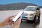 Blank screen smartphone with blurred car  service rental