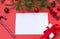 Blank sheet of paper on red background, Lollipop, gift, spruce branch, red balls, cone