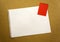 Blank sheet of paper space for design and lettering on a beautiful craft background red notepad sheet. Perforated sheet torn from