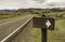 Blank sign with arrow head along the country road