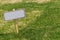 Blank sign on green grass