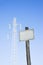 Blank signpost against a blue sky