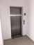 Blank Silver Lift in home Interior. Side View. Empty Lift with buttons close to it. Elevator Interior