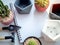 Blank space on white notebook with cactus plants, concrete planters and garden tool set on white background