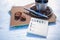 Blank spiral notepads, Cup of Coffee and Pen on Wood Background