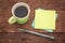 Blank sticky notes and coffee