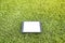 Blank tablet on the grass