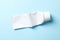 Blank toothpaste tube on blue background