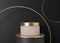 Blank, unbranded cosmetic cream jar standing on golden podium. Skin care product presentation. Elegant mockup. Skincare