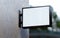 Blank wall sign mockup hung on a store facade. Rectangular outdoor business signage template for branding in realistic 3D