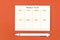 The Blank weekly plan notice block on orange colour background. Empty schedule and a pen