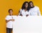 Blank white advertisement board in hands of happy black family