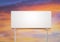 Blank  white billboard for outdoor advertising  at sunset ,ready for product display montage,advertisement
