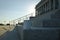 A blank white coffee mug on the corner of the capitol steps