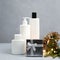 Blank white cosmetics bottles and Christmas gift. Body and hair care concept, Christmas sale of beauty products.