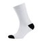 Blank white cotton long sock with black heel on invisible  foot isolated on white background as mock up for advertising, branding.