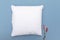 Blank white cushion pillow mockup on a blue background