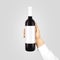 Blank white label mock up on black bottle red wine