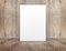 Blank white paper poster leaning at wood wall on wooden floor in