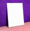 Blank white paper poster on purple leather wall and pink floor,Mock up to display or montage of your content