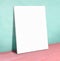 Blank white paper poster on turquoise leather wall and pink floor,Mock up to display or montage of your content