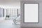 Blank white poster in black frame on light brick wall in spacious modern office with wooden floor and big window. Mock up