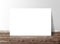 Blank white rectangle paper template banner on the wooden floor