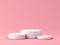 Blank white round podium pedestals or product platforms isolated on pink pastel color background