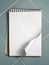 Blank white sketch book on blue