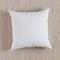 Blank white soft square pillow on a wooden floor, 3D render