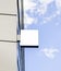 Blank white square sign on glas wall mockup, sky background