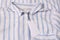 Blank white tags on striped shirt, top view. Space for text