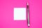 Blank white To Do List Sticker with pen. Searching information on the Internet..Close up of reminder note paper on the pink