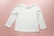 Blank white toddler girl`s long sleeved t-shirt on pink background