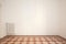 Blank, white wall and decorated floor in a renovated apartment